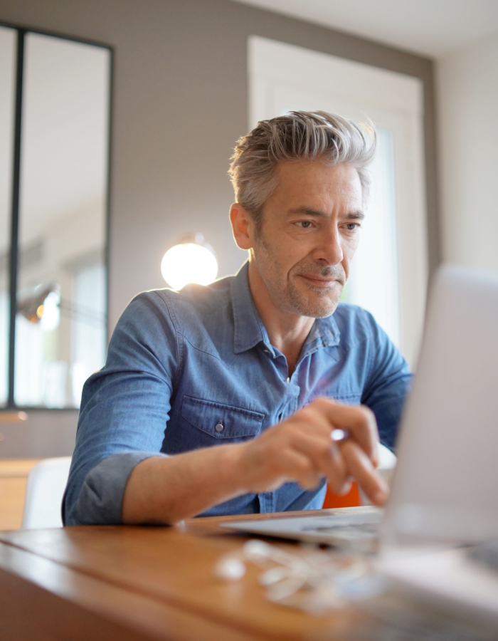 Mature man working from contemporary home